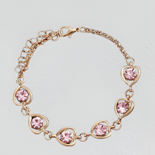 Bracciale dorato con pietre rosa